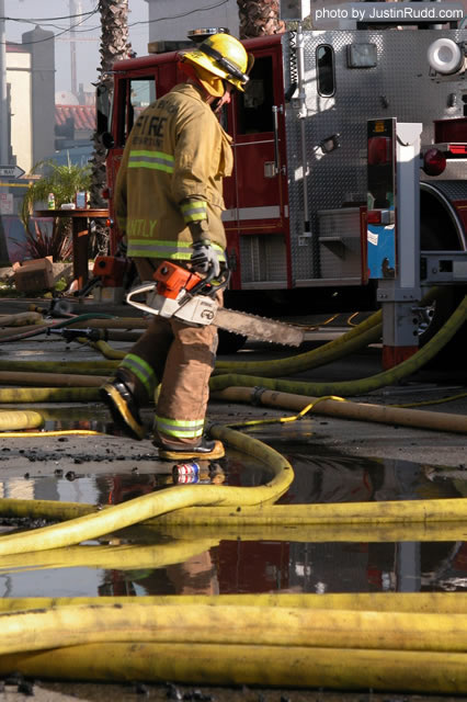 Chain saws were utilized by firefighters to attack the fiery monster.